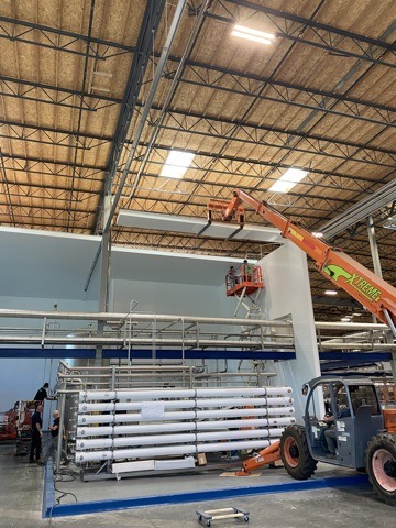 DCW crew working at height during large facility refrigeration buildout